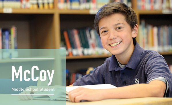 A Harker student, McCoy, smiling at the library
