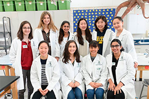 Upper and lower school students from WiSTEM Club (Women in Science, Technology, Engineering and Math) smiling